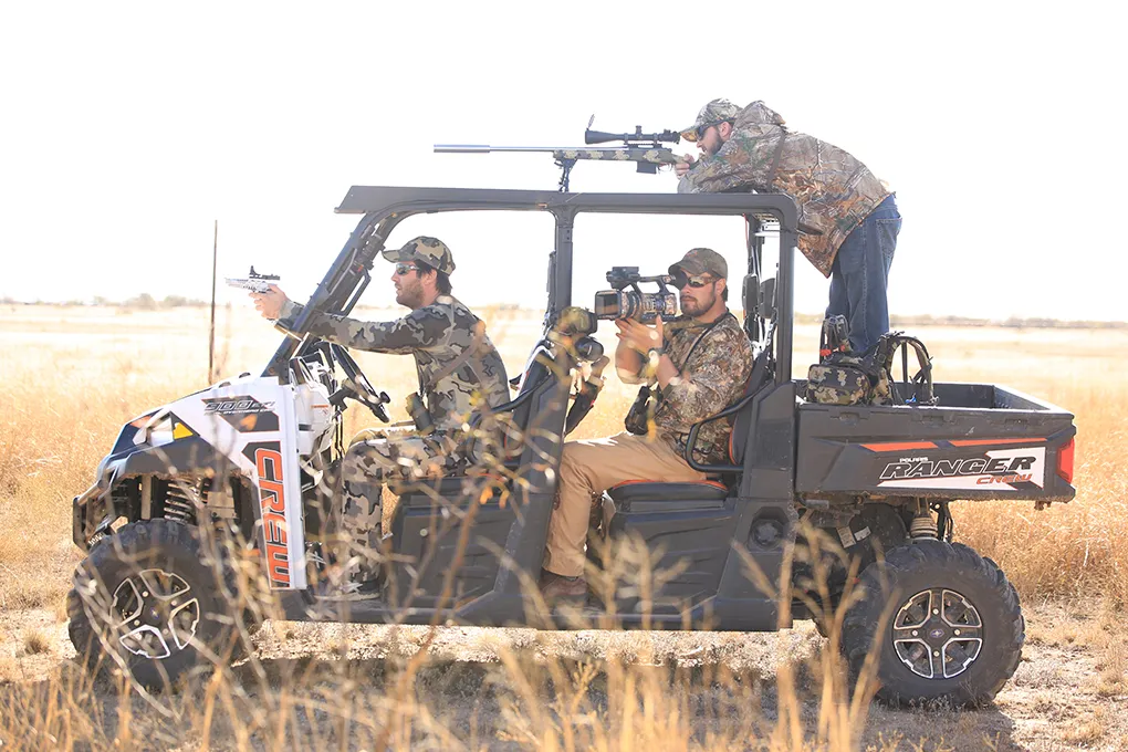 Hunters running the property by UTV
